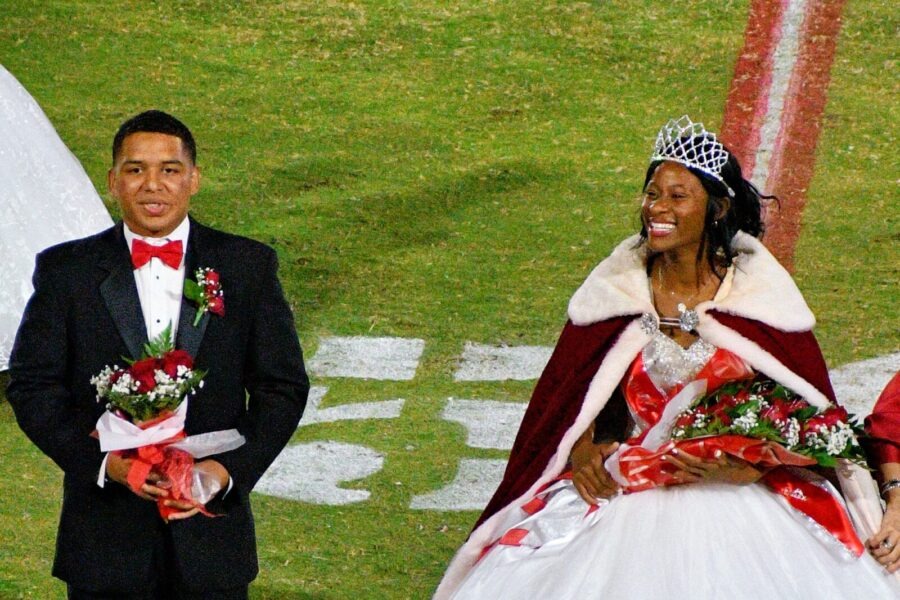 a man and a woman dressed in wedding attire