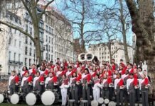 a group of men and women in red and white outfits