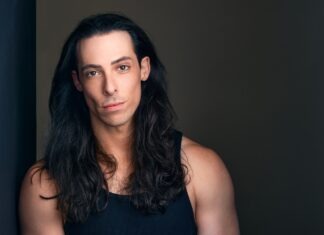 ‘ROCKY HORROR SHOW’ RETURNS TO WATERFRONT PLAYHOUSE a man with long hair and a black tank top