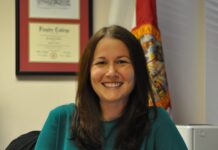 a woman sitting at a desk in an office