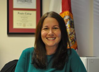 a woman sitting at a desk in an office