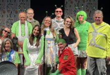 a group of people standing on top of a stage