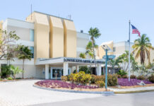 a large building with a flag on top of it
