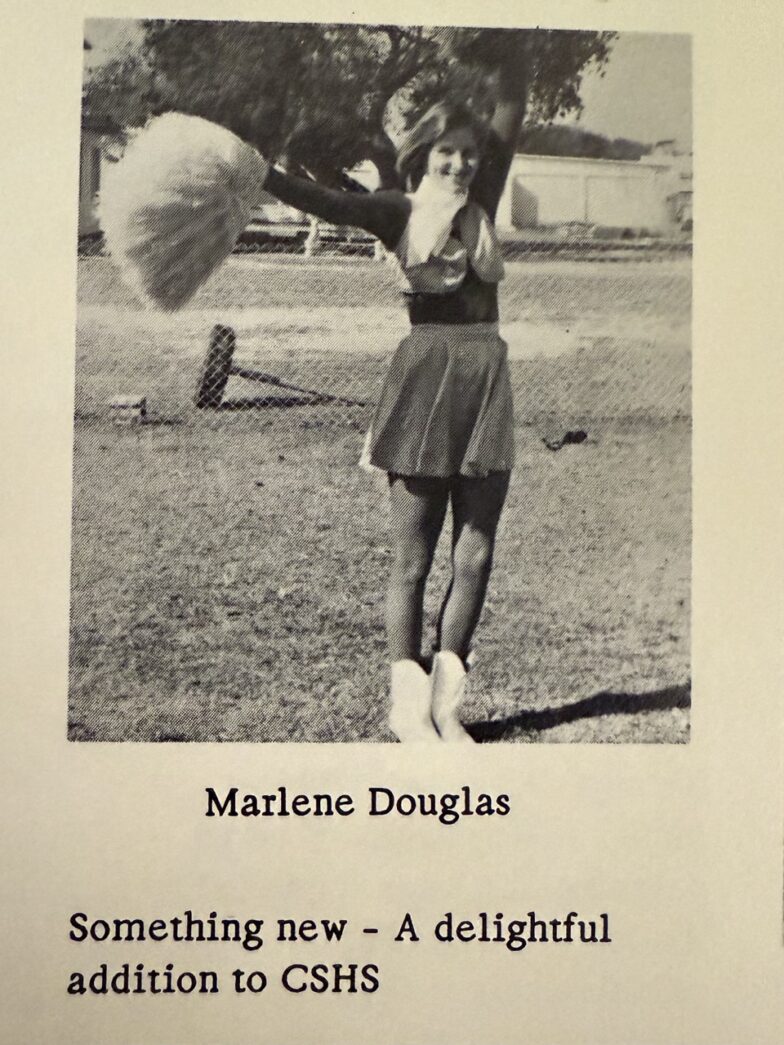 a black and white photo of a girl holding an umbrella