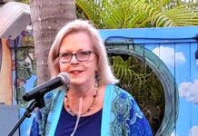 a woman standing in front of a microphone