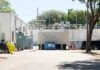 ‘OH SHHH’: DEP ORDERS ISLAMORADA TO FIX ISSUES CAUSING SEWER LINE BREAKS, WASTEWATER OVERFLOWS a parking lot with a building in the background