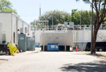 a parking lot with a building in the background