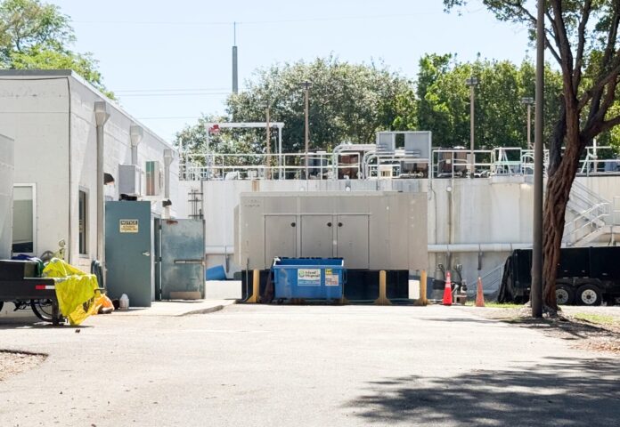 NPK pump station a parking lot with a building in the background