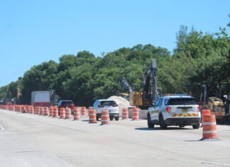WATER MAIN WORK APPROACHES UPPER KEYS SCHOOLS; TRAFFIC PLANS IN PLACE AT VARIOUS INTERSECTIONS a construction area with construction cones and cars