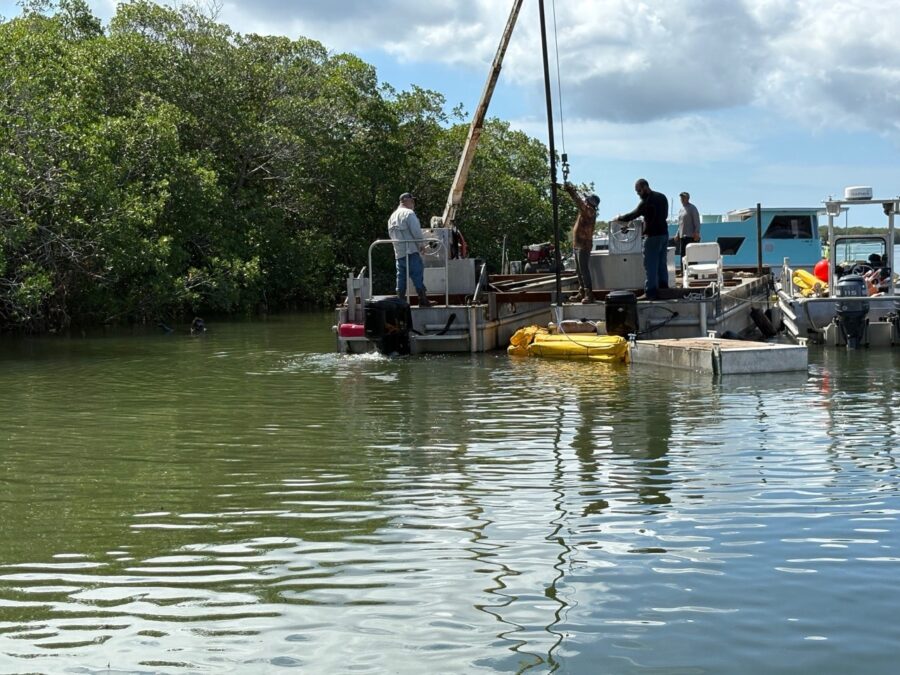 a group of people on a boat in the water