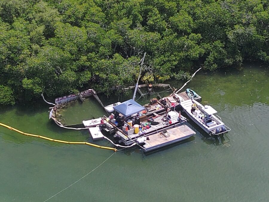 a boat tied to a dock in the water