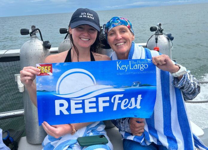 REEF Fest 1 (1) a couple of women sitting on top of a boat