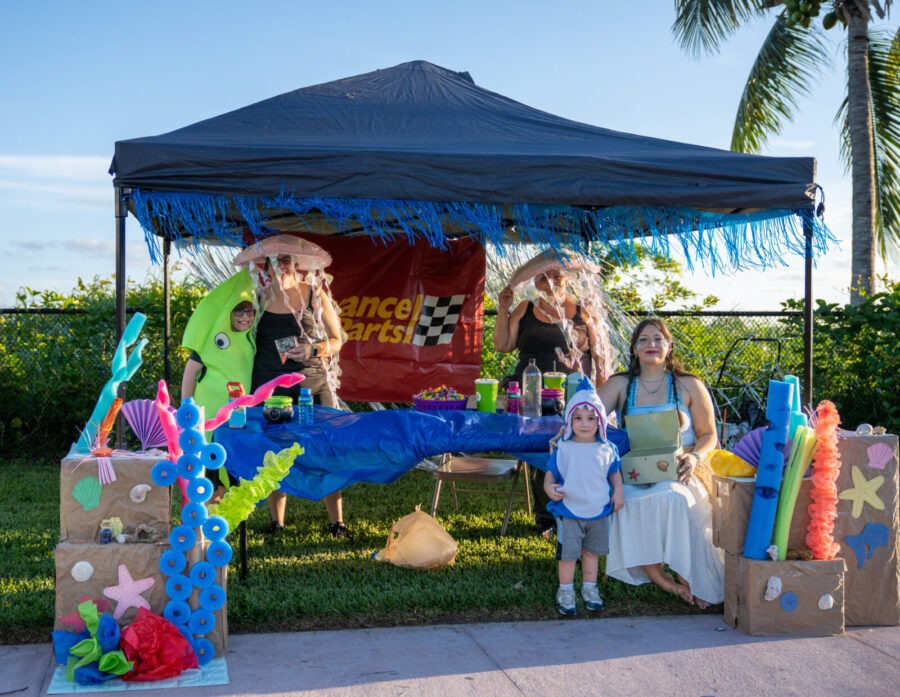a group of people standing under a tent