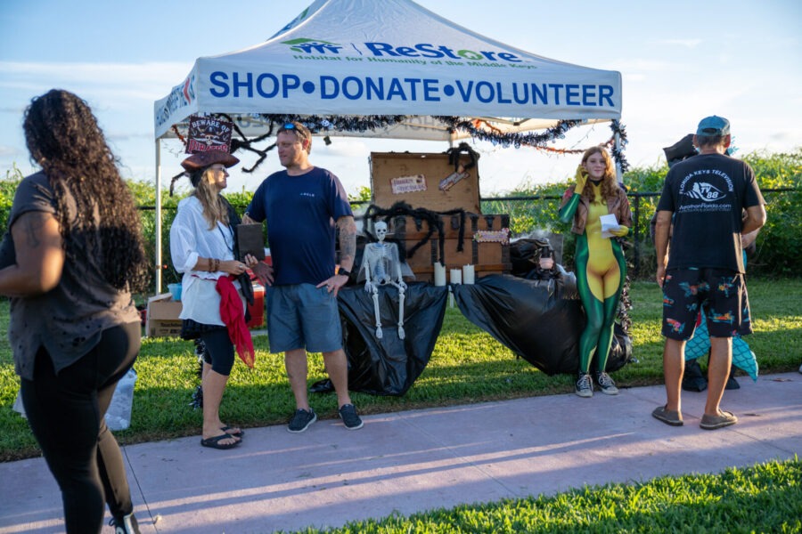 a group of people standing under a tent