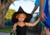 COSTUMED CUTENESS: MIDDLE KEYS KIDS CHASE CANDY AT TRICK OR TREAT AT SOMBRERO BEACH a little girl in a witches costume walking down the street