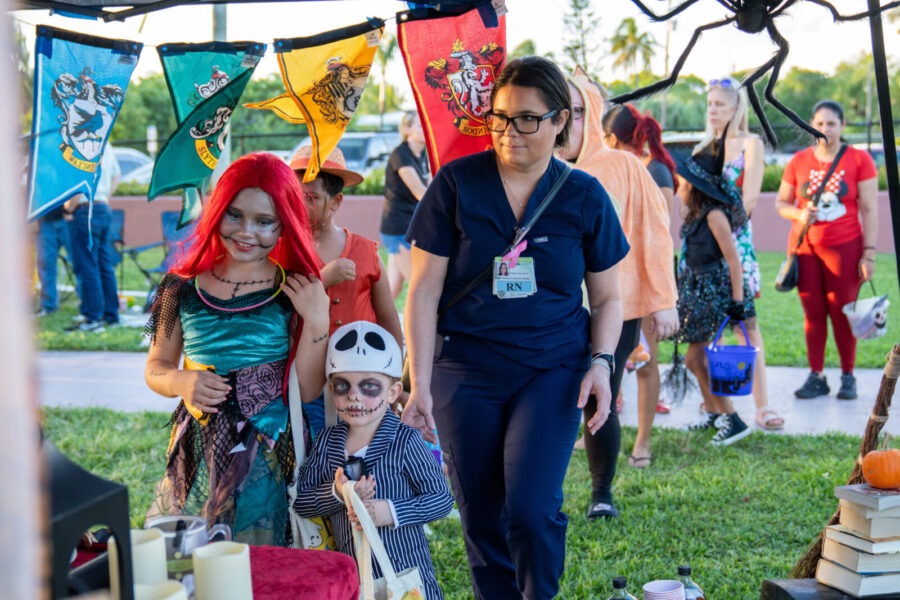 a group of people standing under a tent