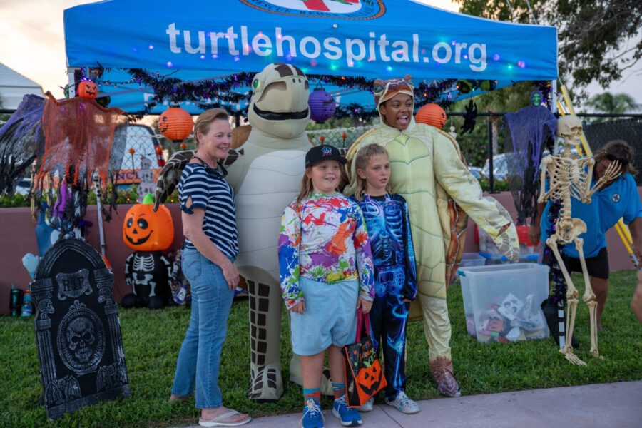 a group of people standing in front of a tent