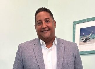 KEY WEST’S INDICTED FORMER ATTORNEY SUES CITY FOR LEGAL BILLS  a man in a suit standing in a room