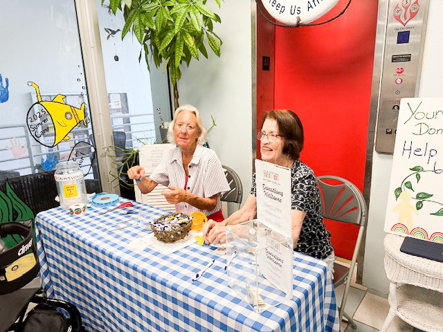 a couple of people sitting at a table