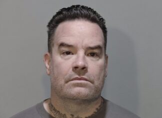 a man with a tattoo on his neck