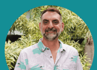 a man with a beard wearing a shirt