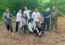 a group of people in costume posing for a picture