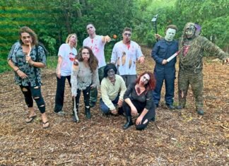 a group of people in costume posing for a picture