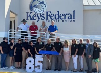 KEYS FEDERAL CREDIT UNION TURNS 85; GETS NEW DIGS ON STOCK ISLAND a group of people standing in front of a building