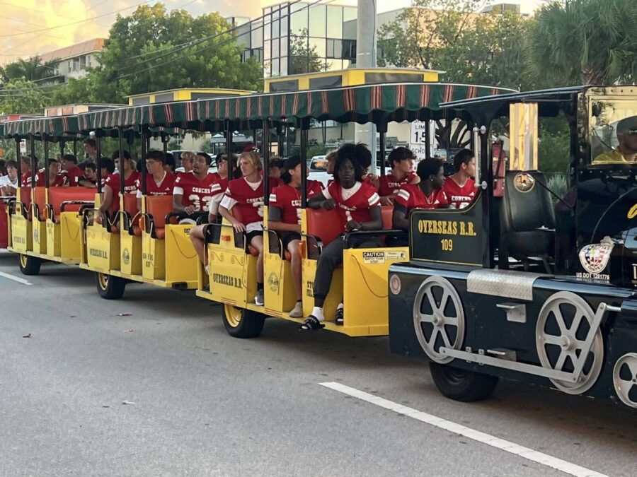 a group of people riding on the back of a train