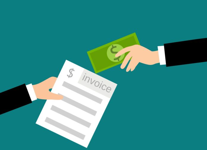 two people shaking hands over a piece of paper
