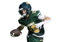 a man in a football uniform holding a football
