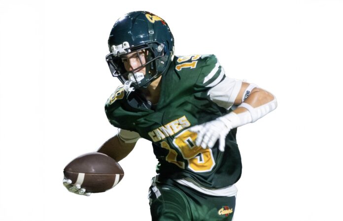 a man in a football uniform holding a football