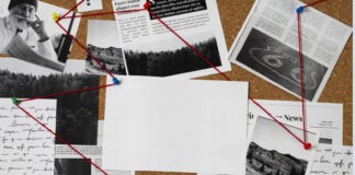 a bulletin board covered in lots of papers