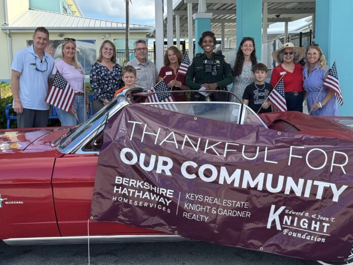a woman lifting a barbell in a gym