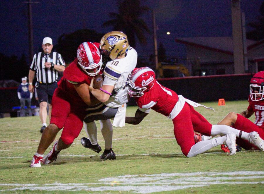 a group of football players playing a game of football