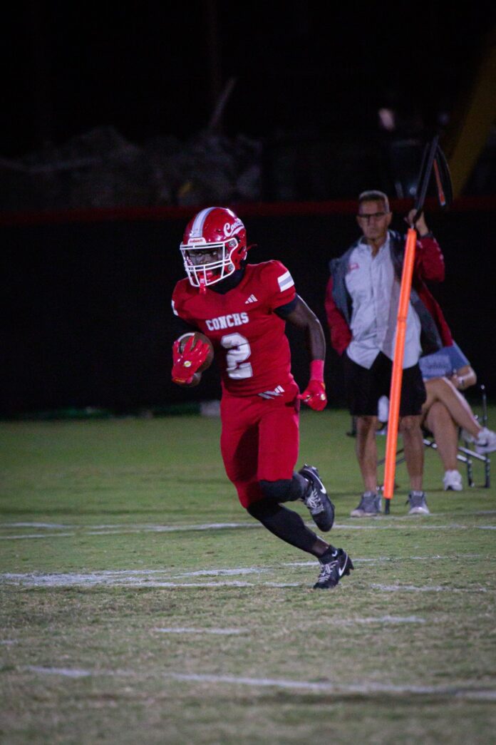 a football player running with the ball