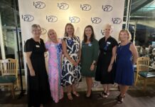 a group of women standing next to each other