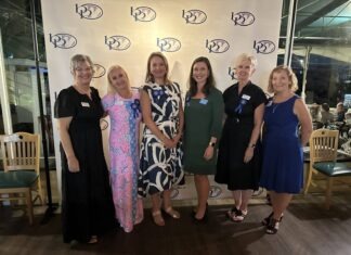 a group of women standing next to each other