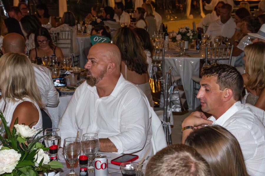 a group of people sitting around a table