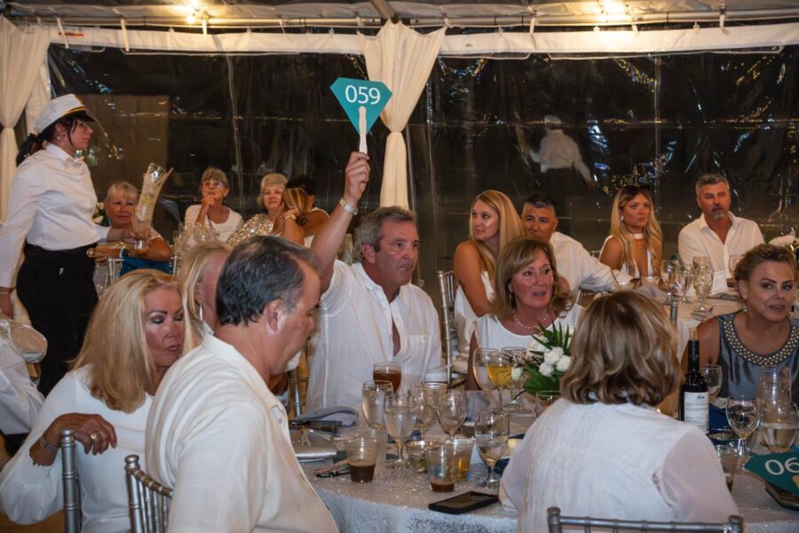 a group of people sitting around a table