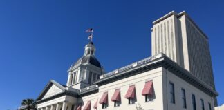 a large building with a flag on top of it