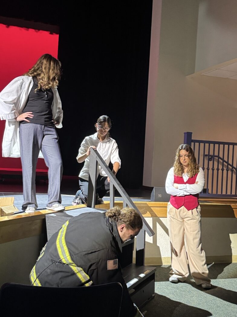 a group of people standing on top of a stage