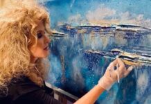 EXPERIENCE WILDLIFE & WHIMSY AT WILSON SIGNATURE COLLECTION a woman is painting a picture on a canvas