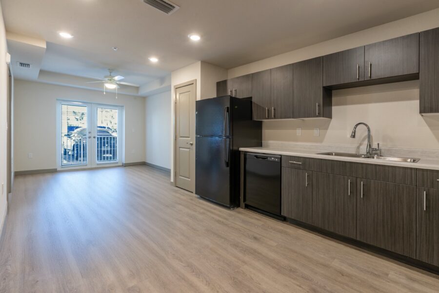 an empty kitchen and living room in an apartment
