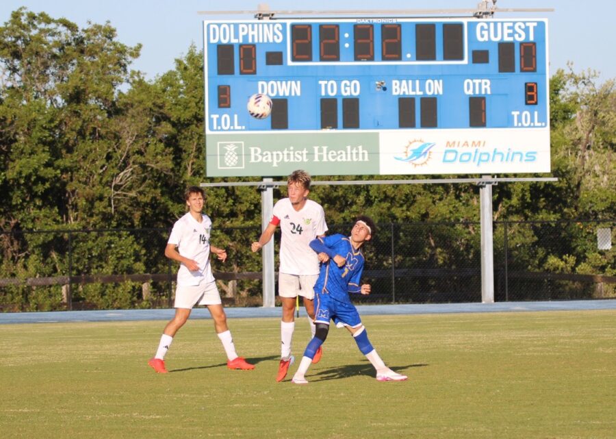 a group of young men playing a game of soccer