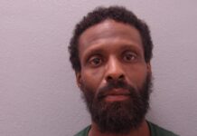 a man with a beard and a green shirt