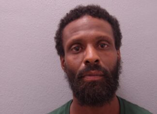 MAN ARRESTED AFTER HE ALLEGEDLY STOLE A TAXI IN MARATHON a man with a beard and a green shirt