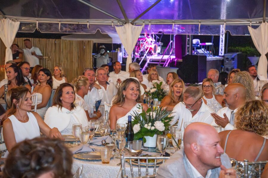 a large group of people sitting around a table