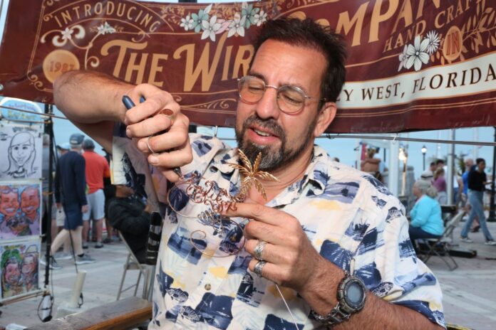a man holding a piece of food in his hand