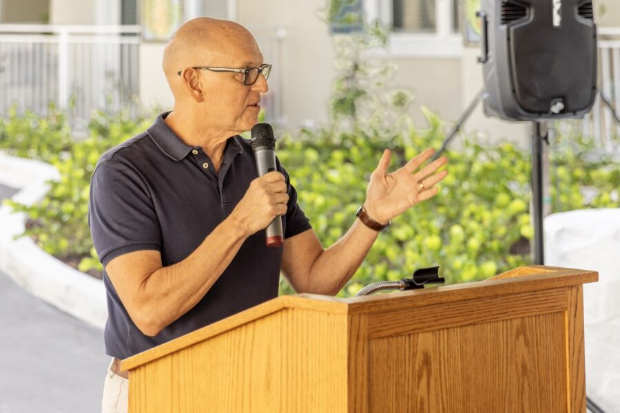 a man standing at a podium giving a speech